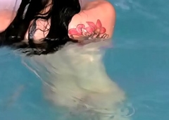 Big ass tranny plays with her massive pecker in pool and ejaculates