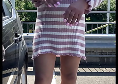 kelly cd on a carpark in pink jumper dress and minimal pantyhose